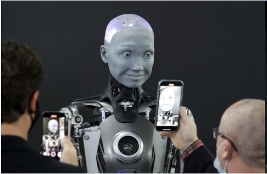 Ameca humanoid robot by Engineered Arts, with a grey face and expressive features